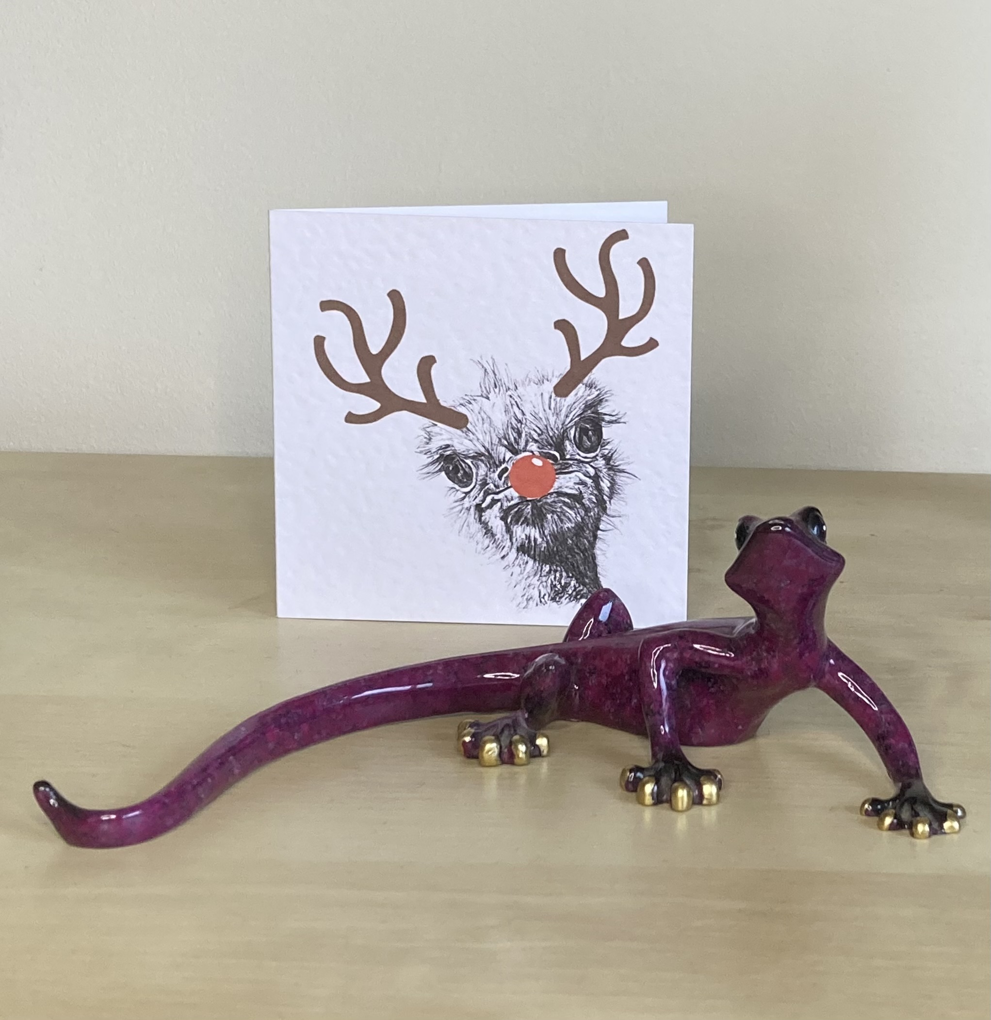 Ostrich with reindeer antlers and red nose Christmas card by Louisa Hill