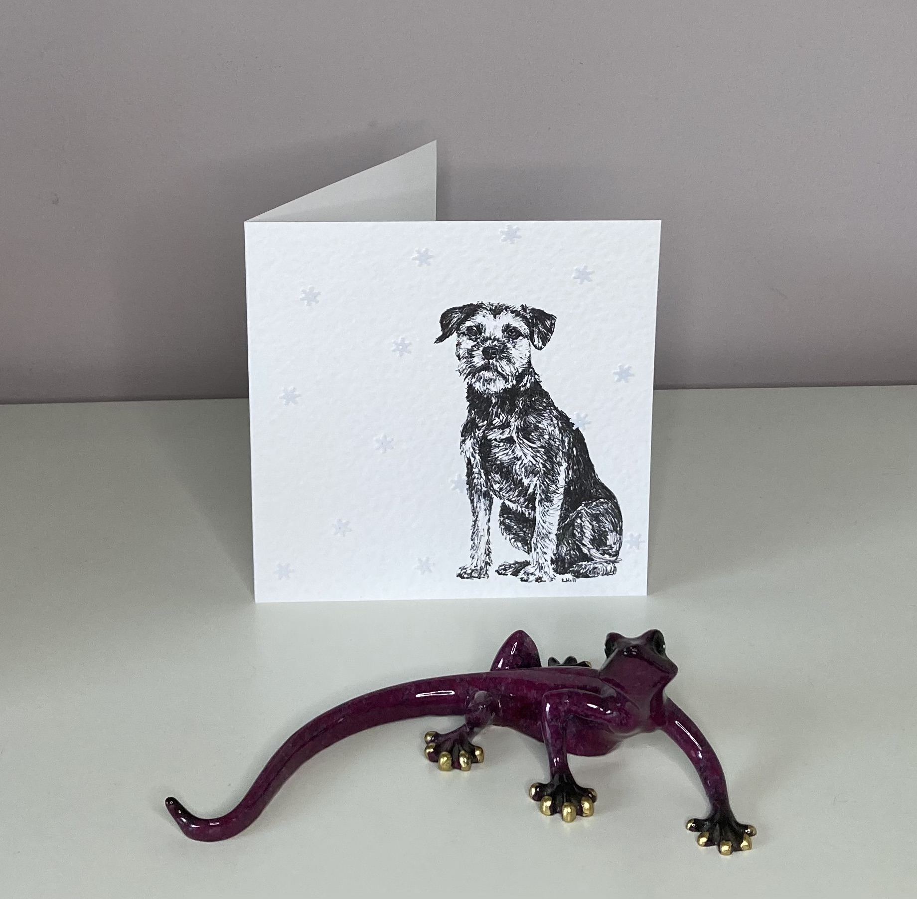Border Terrier with snowflakes Christmas card by Louisa Hill