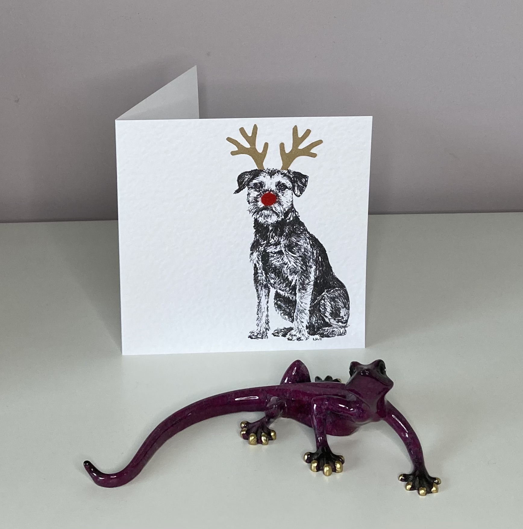 Border Terrier with reindeer antlers and red nose  Christmas card by Louisa Hill