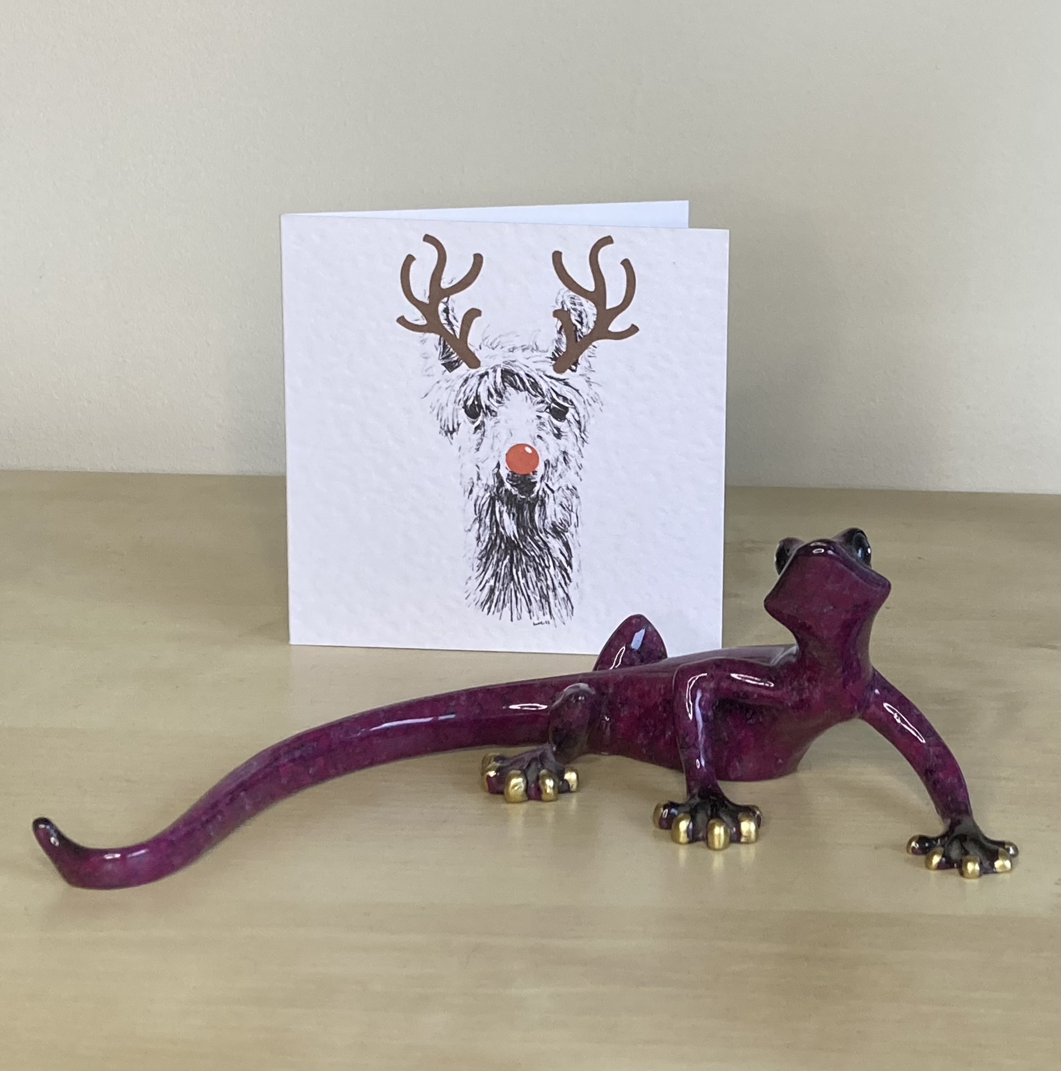 Llama with reindeer antlers and red nose Christmas card by Louisa Hill
