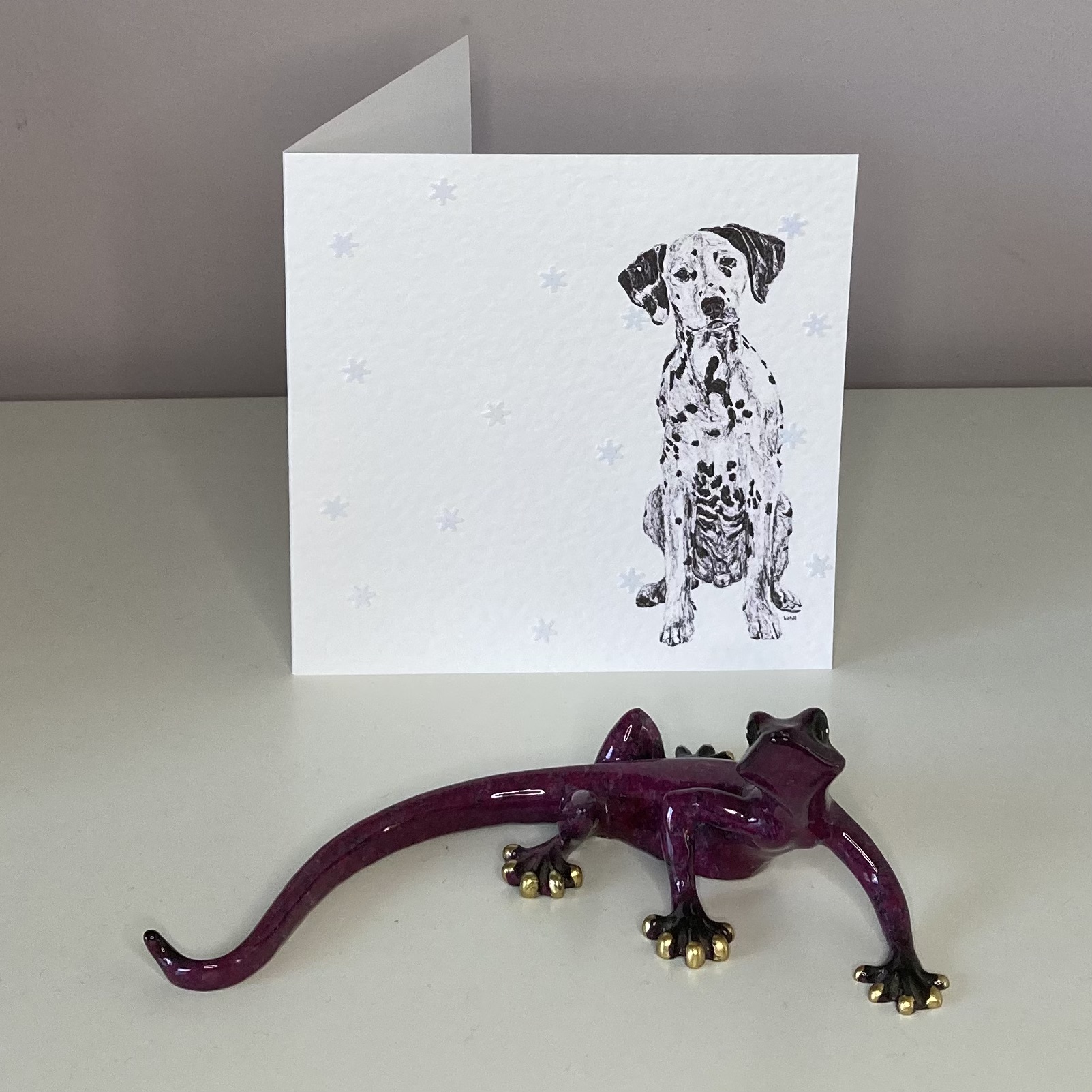 Dalmatian with snowflakes Christmas card by Louisa Hill